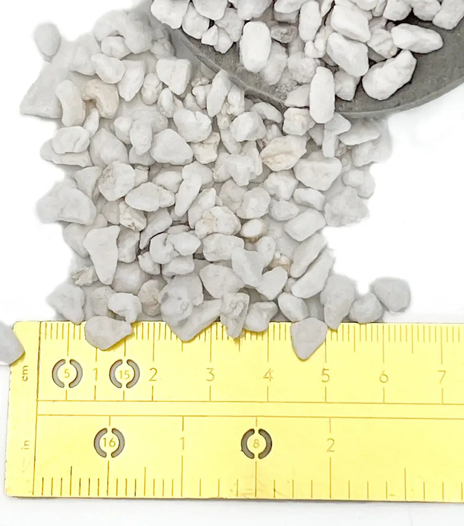 Premium Coarse Perlite granules with ruler for scale, ideal for improving soil aeration in rare indoor plants. Chalet Boutique, Australia.